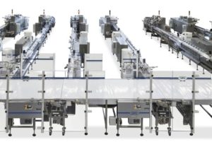 Complete and fully automatic system for high speed packing of cakes
